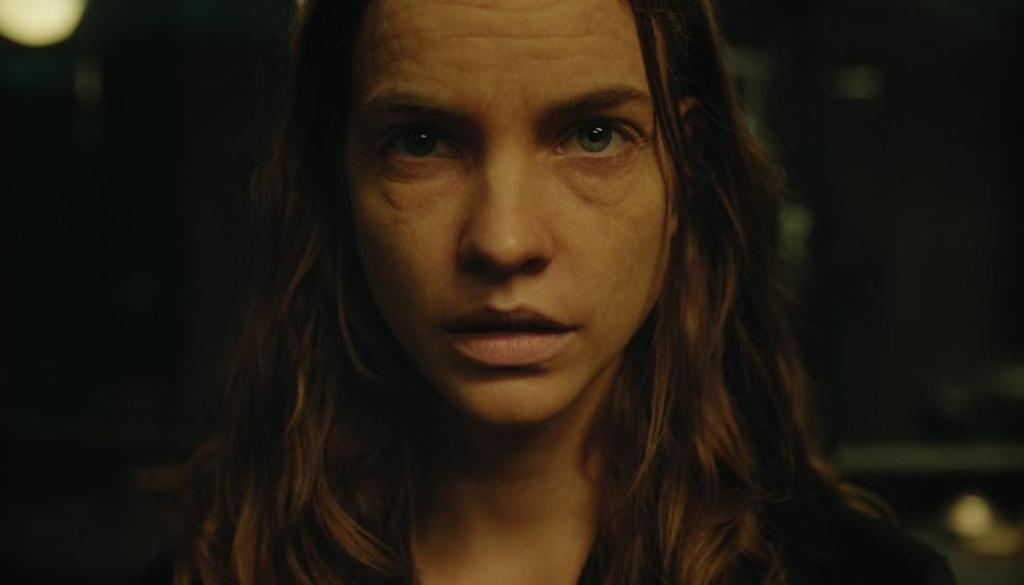 Barbara Palvin in the lead role of Eve from the independent horror short film Serpentine, showing dramatic facial expression in supernatural scene