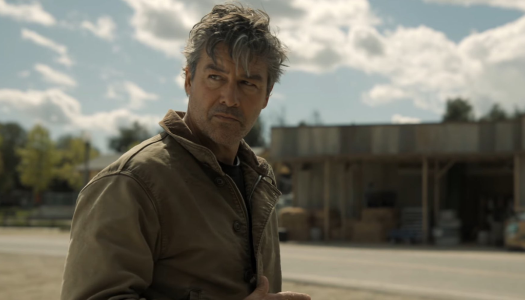 Kyle Chandler portraying veteran Green Lantern Hal Jordan in the Lanterns HBO series promotional still, showing serious and determined expression